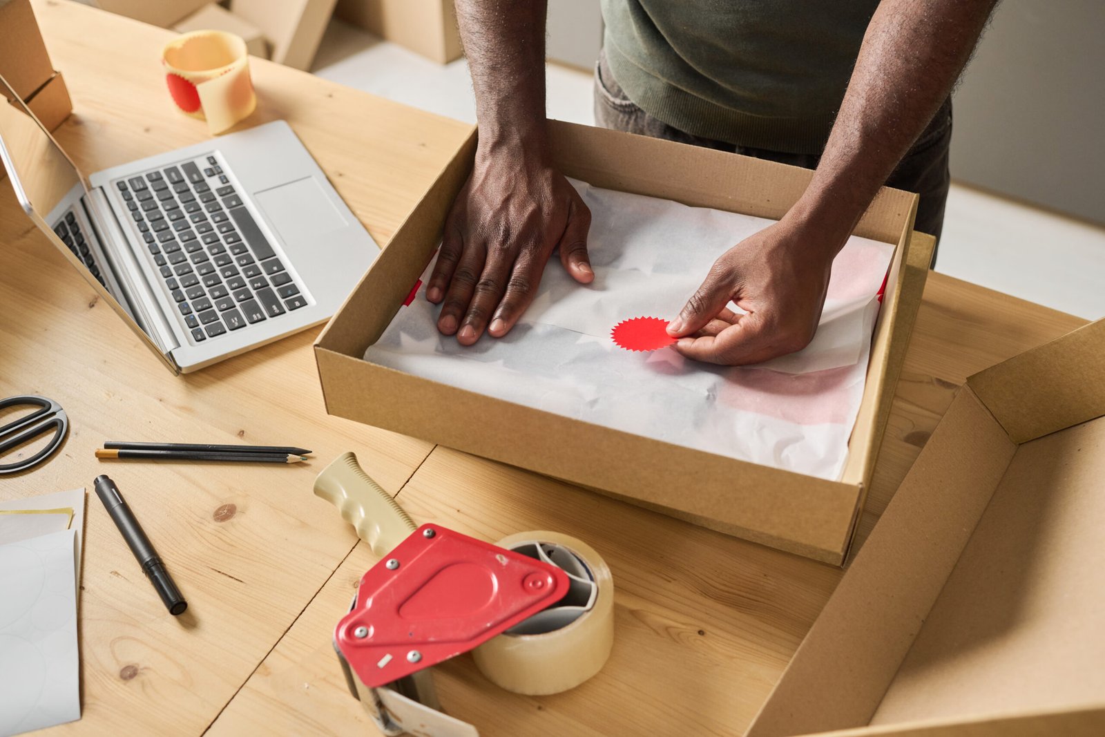 a person packing a box